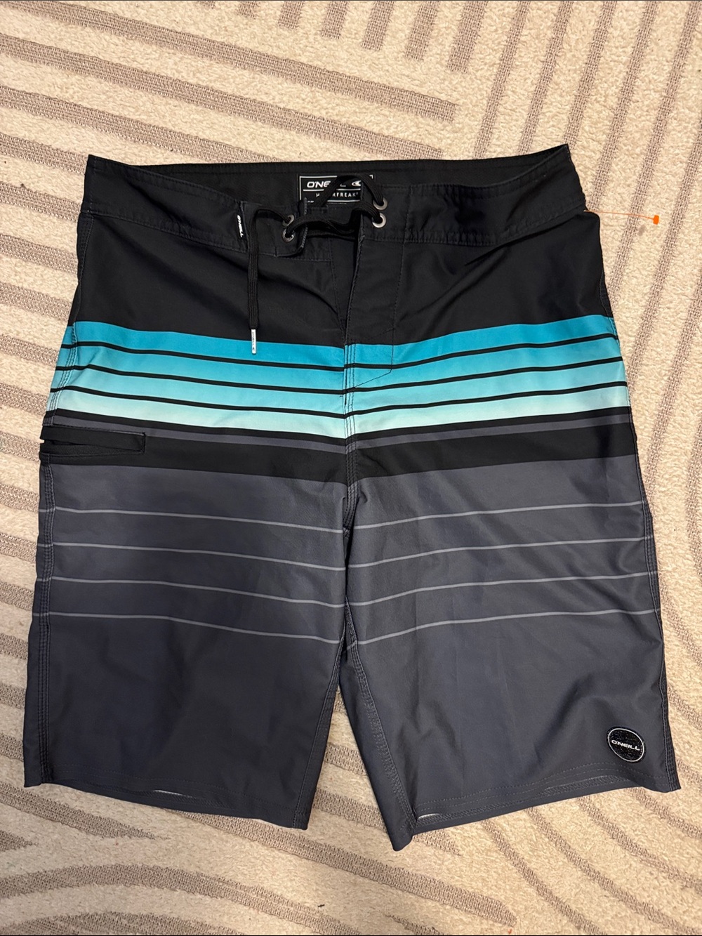 O'Neill Black Swim Shorts with Teal and Light Blue Stripes